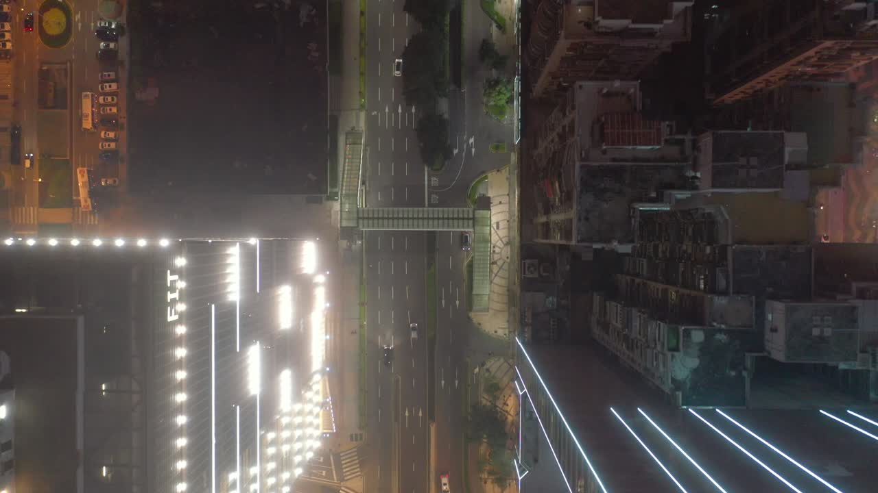flight over macau traffic streets night illuminated aerial topdown panorama 4k china
