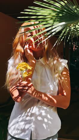 woman with flowers in a tropical setting