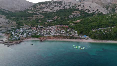 stara baska, krk island, croatia, aerial view of the mountains and coast with boats, beaches and adriatic sea. the seaside rv campmobiles on a summer beautiful coastline at sunset summer evening
