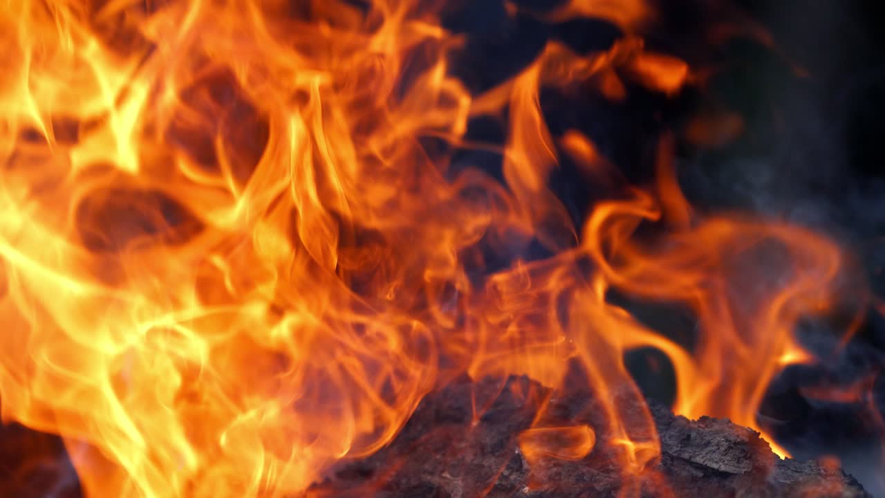 Heat and flame in the fireplace. Close up of intense flames in a fire