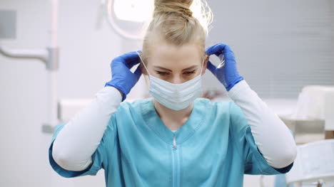 dentist putting on protective mask before surgery 2