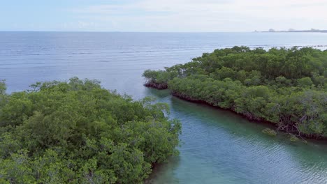 Aerial-rising-shot-over-boat,-establishing-wide-ocean-in-Santo-Domingo