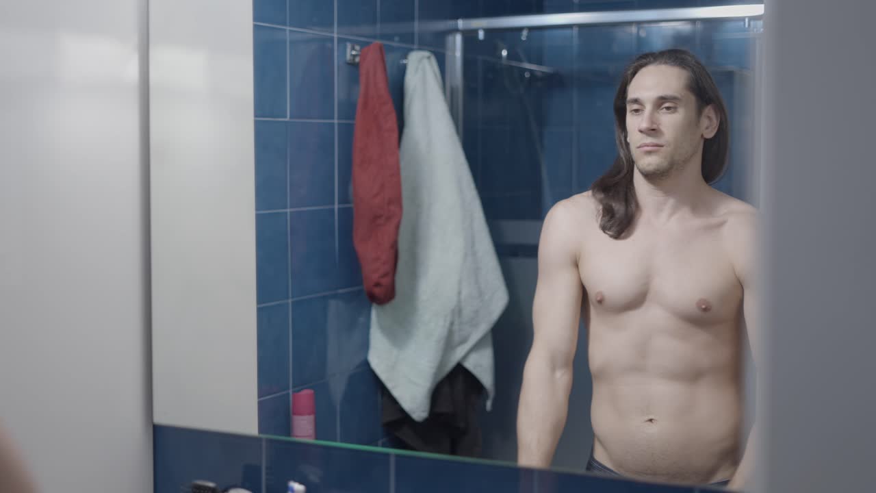 Man getting ready in bathroom