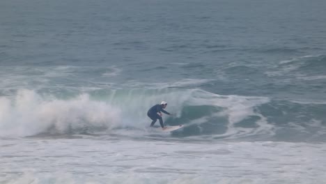 surfer generating significant speed with trimming movements and finishing with a jump at the end