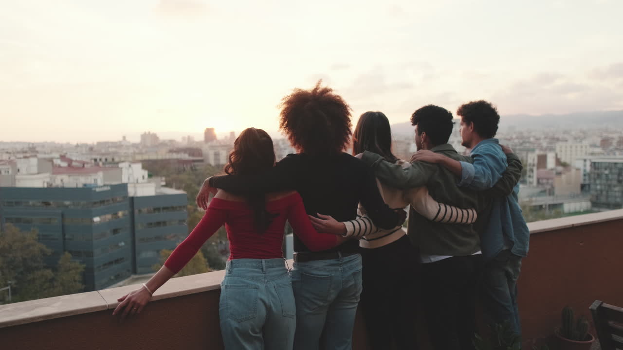Friends Enjoying Sunset View from Rooftop