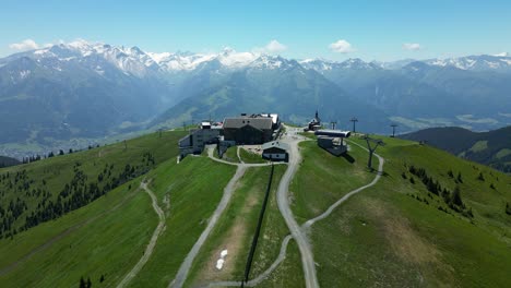 mountains of snowy peaks are the background to schmittenhohe resort