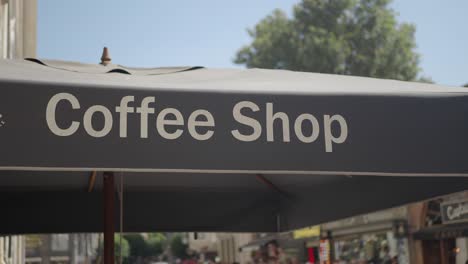 coffee shop sign on umbrella