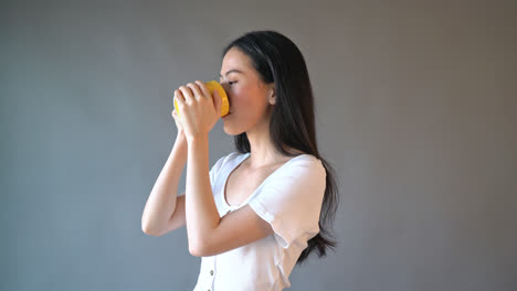 young asian woman with happy face and hand holding coffee cup