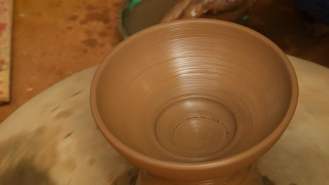 potter at work makes ceramic dishes. india, rajasthan.