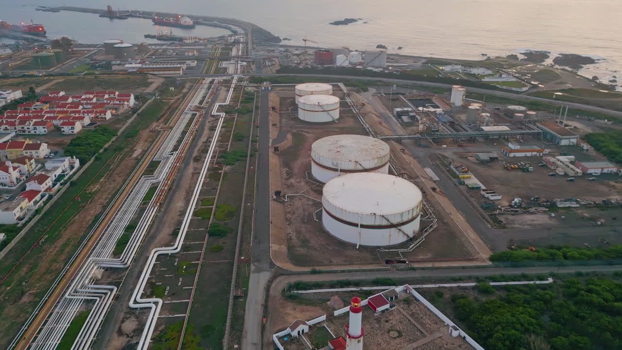 Aerial view refinery storage construction at sea. Oil fuel facility in port town