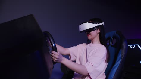 woman using vr headset in racing simulator