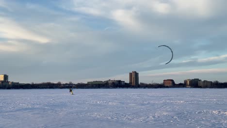 Extreme-winter-sport,-Snow-kite-over-a-frozen-lake-Minnesota