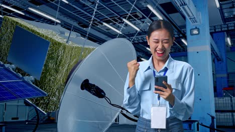 woman celebrating success in a satellite factory