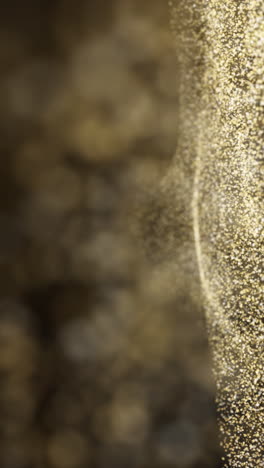gold glitter dust texture. gold particles. luxury design. loop animation. vertical video.