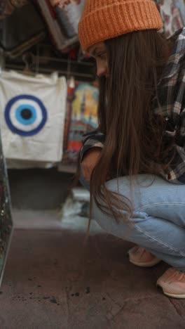 woman browsing souvenirs at a street market