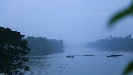 sunrise in backwaters,fishermen arriving shore