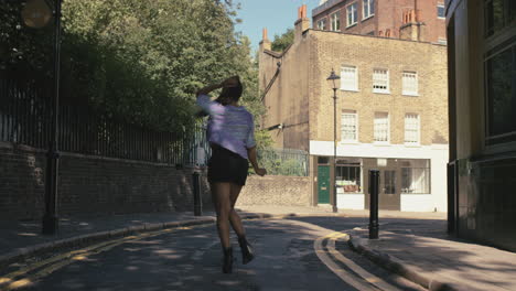 contemporary funky african american woman street dancer dancing freestyle in the city