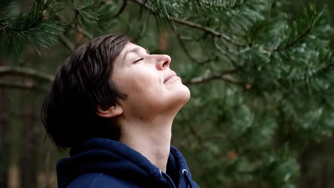 Woman Relaxing Under Pine Tree