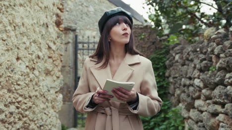 woman with french hat in the small italian hamlet finding inspiration