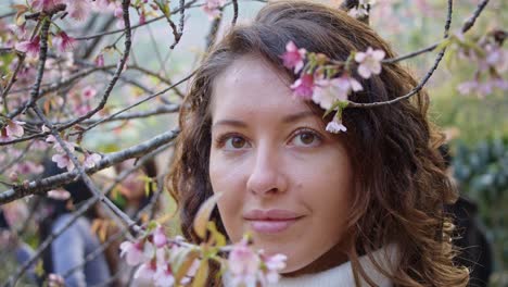 woman amongst cherry blossoms