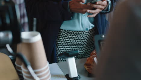 beautiful-mixed-race-woman-paying-using-credit-card-transaction-service-buying-coffee-in-cafe-spending-money-at-restaurant