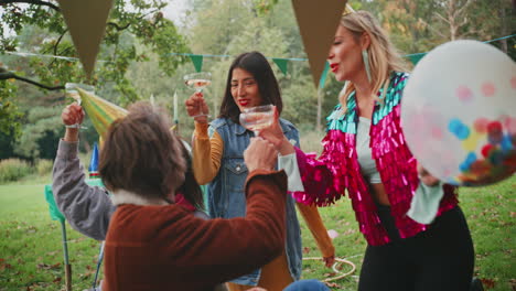 friends celebrating a birthday in a park