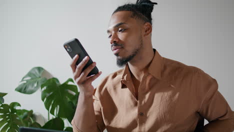 Busy-man-chatting-mobile-office-closeup.-Freelancer-working-laptop-ending-call