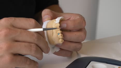 detailed dental prosthesis preparation using precision tools in close up