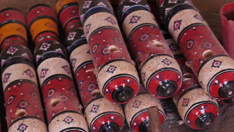 Wooden-Colourful-Charpai-Traditional-Bed-Leg-Posts-Resting-On-Workshop-Floor