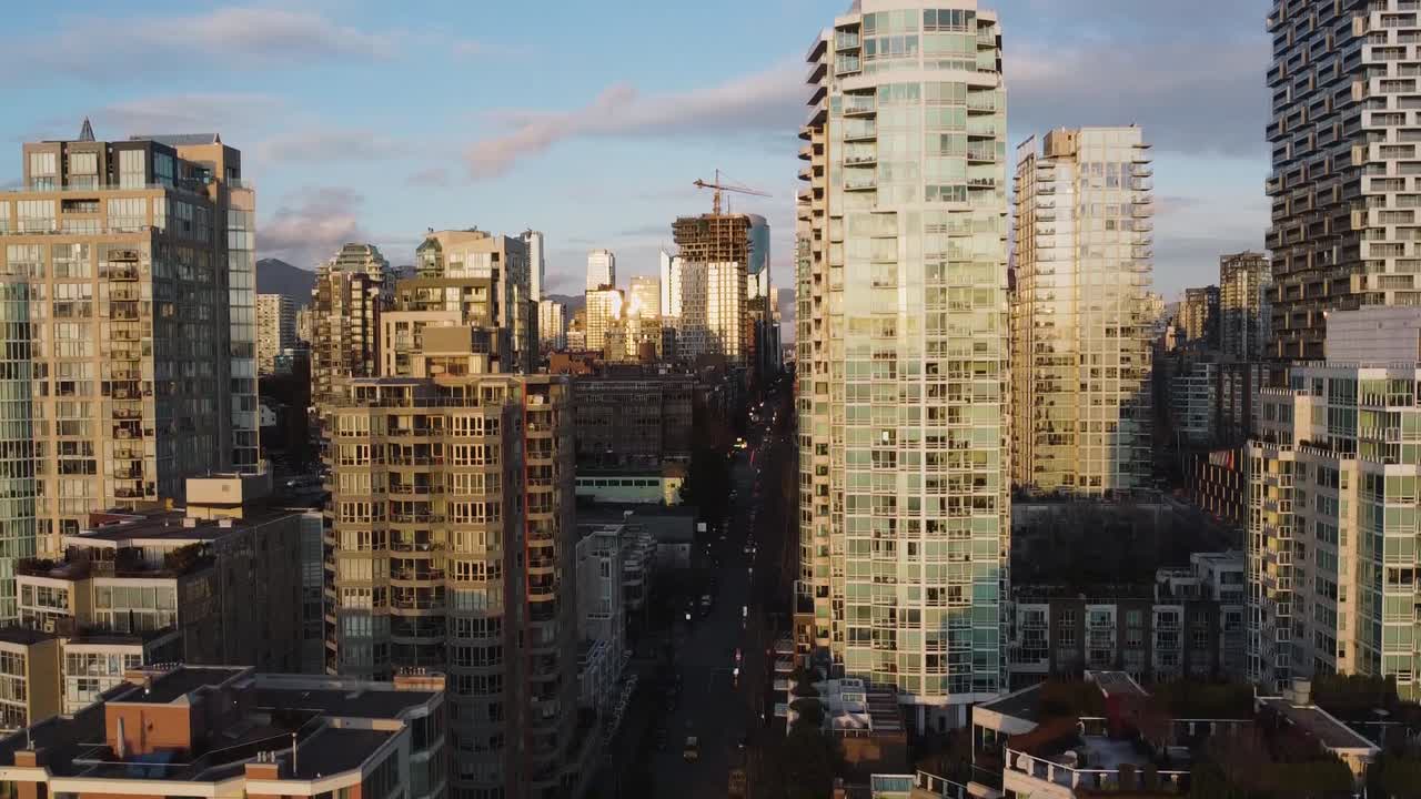 Down-top shot of the centre of the city of Vancouver with Vancouver House. Aerial video shot by drone