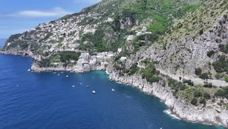 amalfi coast at praiano in salerno italy. coastal city. waterfront landscape. amalfi coast at praiano in salerno italy. beach scenery. medieval buildings. amalfi coast skyline