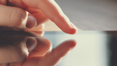 Close-up-hands-touching-tablet-computer