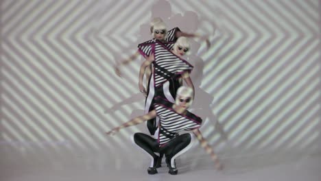 stylish dancers in geometric outfits