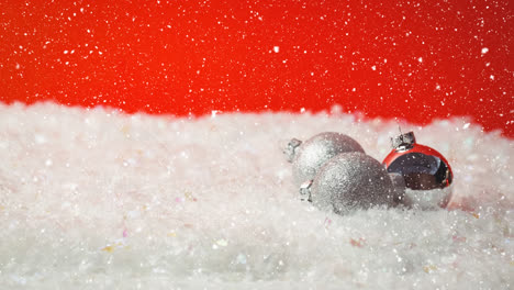 falling snow with christmas baubles decoration