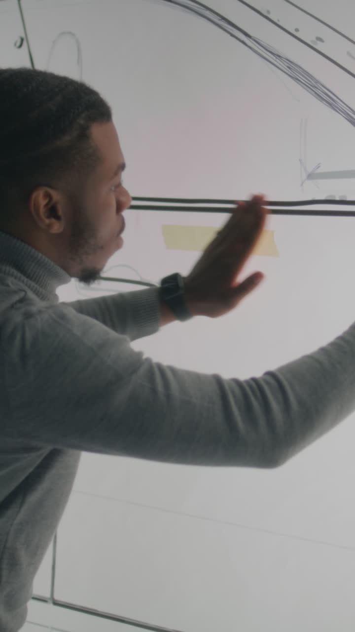 Person Sketching on a Wall