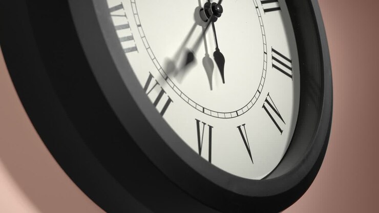 Latin Clock Face on Cream Beige Wall