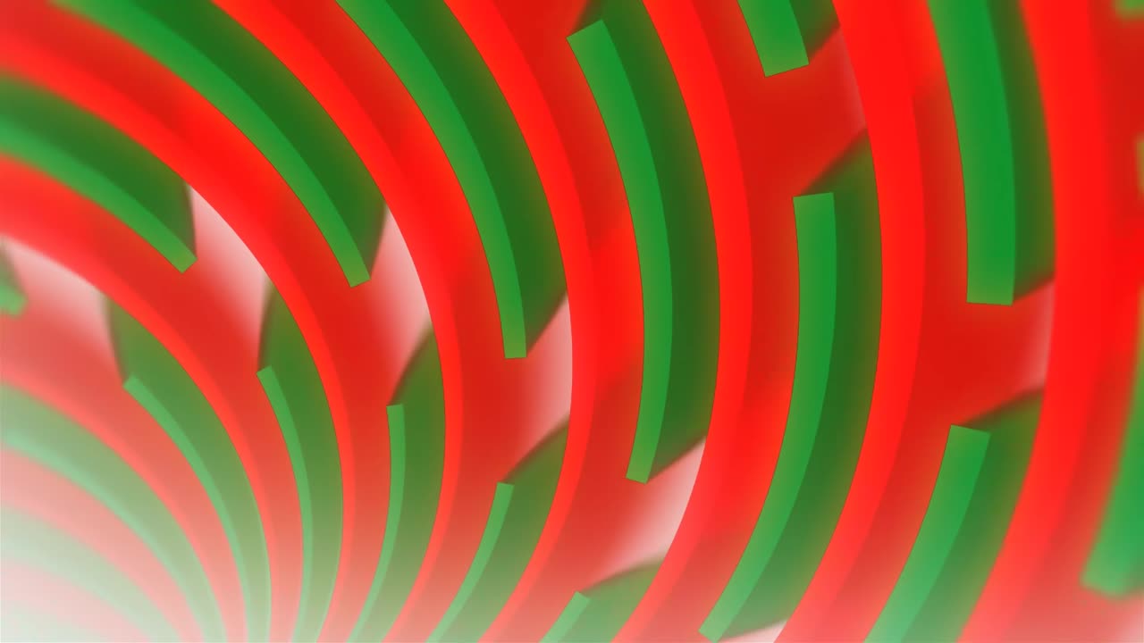 Forme geometriche astratte rosse e verdi che ruotano e si espandono
