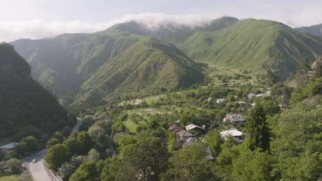 aerial view of daba settlement and green mountain range at summer in georgia