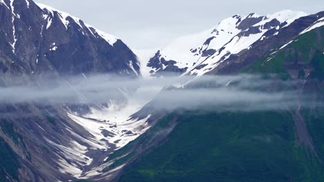 A-U-shaped-glacial-valley-in-Alaska---ice-melted,-isolated-with-low-clouds