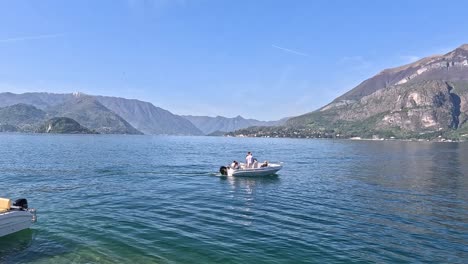 people boating with scenic mountain backdrop