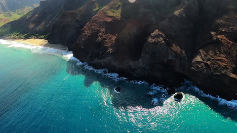 aerial view of hawaiian coastline with dramatic cliffs and turquoise water
