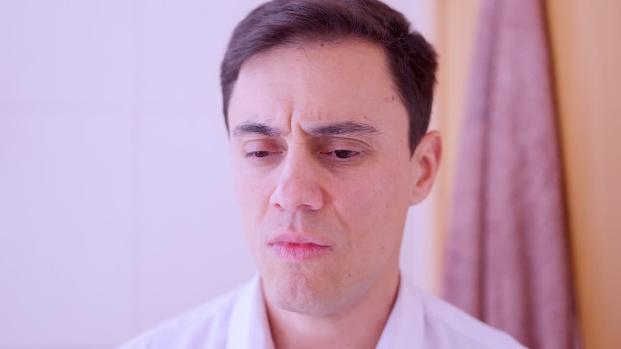 Sad businessman looking at mirror reflecting his depression