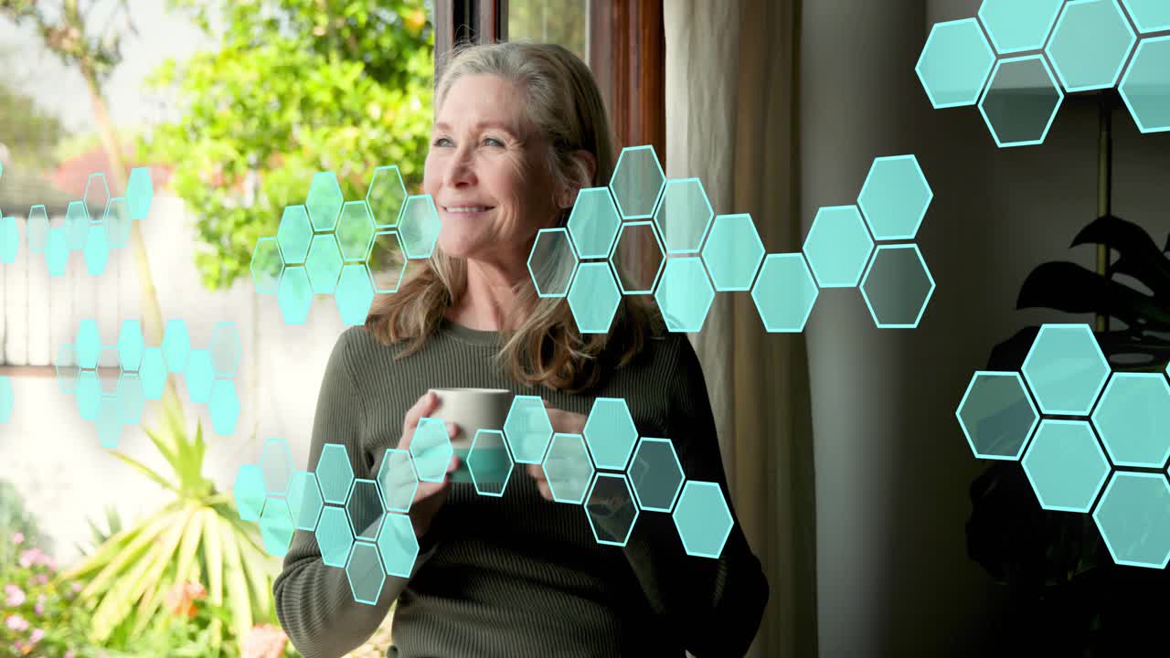 Senior woman picking up mug on sill for wellness, sipping as teal hexagons drifting across frame