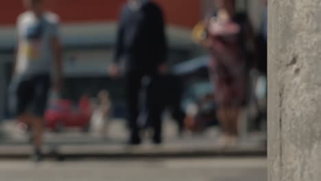 people walk along the pedestrian crossing cars pass by 2