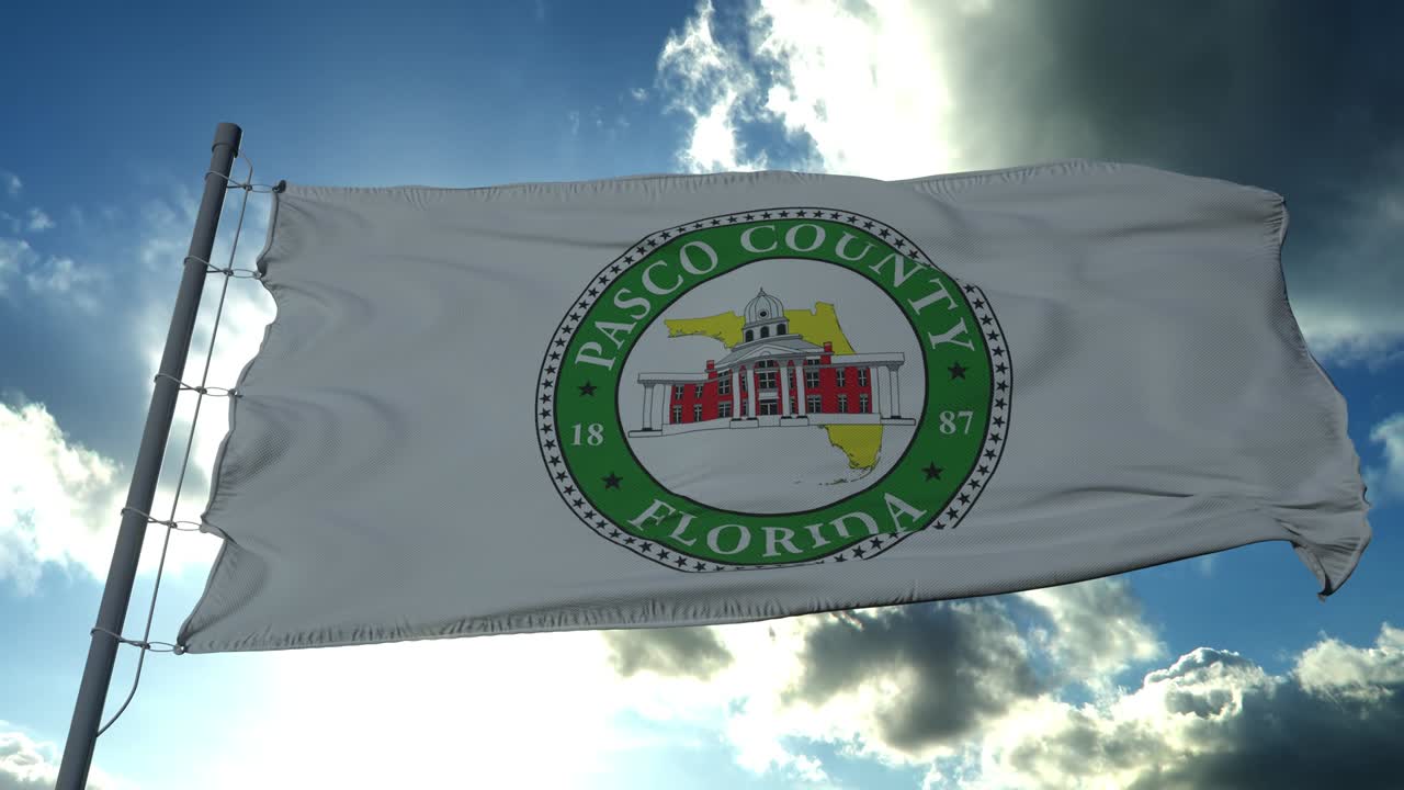 Pasco flag, county of the state of Florida, United States of America waving at wind in blue sky