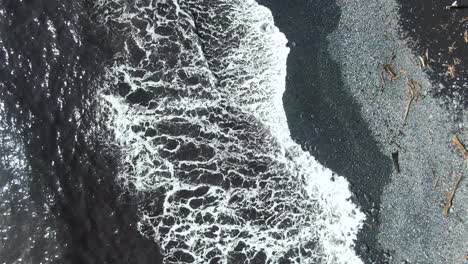 road leading trough extreme cliff coastline in hawaii, aerial top down view