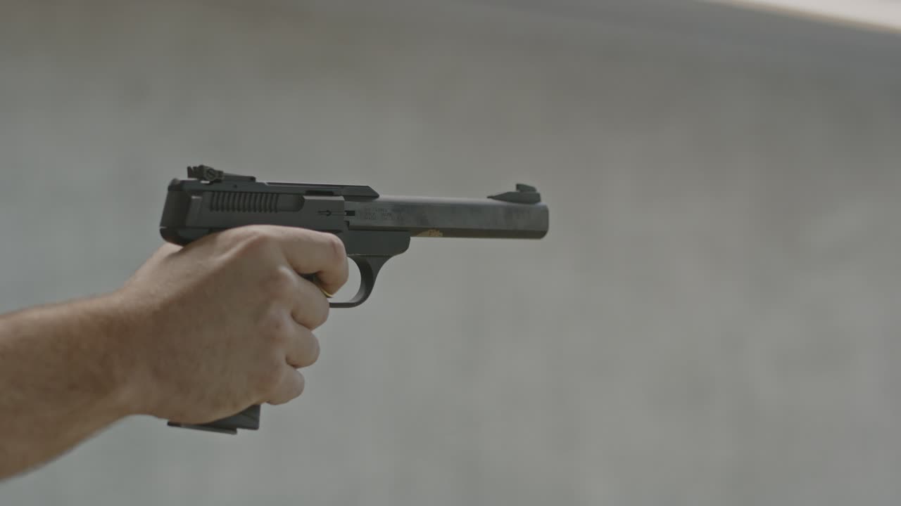 Shooter slowly and securely firing two shots and placing his finger above the trigger