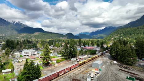 Cargo-Trains-On-The-Railway-Surrounded-By-Mountains-In-Hope,-British-Columbia,-Canada