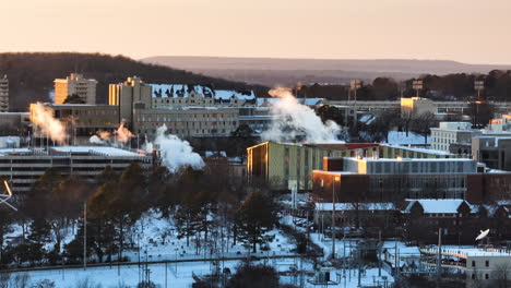 smokes above buildings in fayetteville city in washington county, northwest arkansas