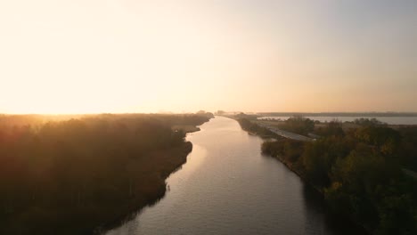 sunrise over a canal in the dutch countryside